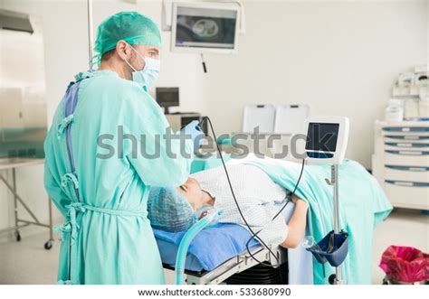 Rear View Doctor Using Scope Monitor Stock Photo Edit Now 533680990
