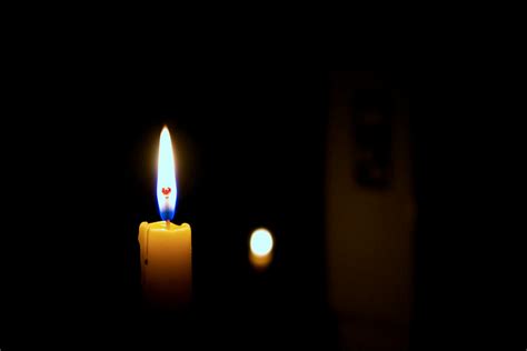 Close Up Of Lit Candle In Darkroom · Free Stock Photo