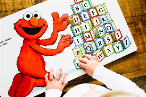 The pages are a cross between a standard book and a board book, so. elmo lift the flap book - Everyday Reading