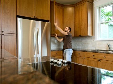 Measure up the wall about 48 in (120 cm) or 19 1 ⁄ 2 in (50 cm) above a lower cabinet. Installing Kitchen Cabinets: Pictures, Options, Tips ...