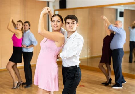 Cheerful Young Guy And Girl Practicing Ballroom Dances In Ballroom Stock Image Image Of