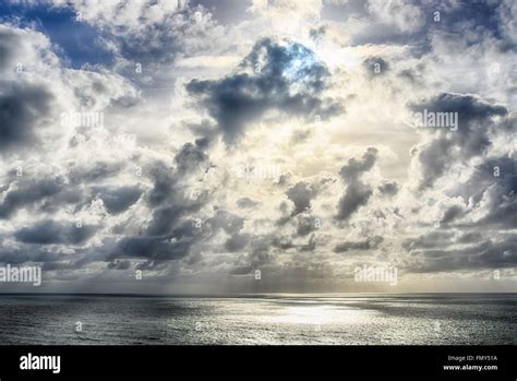 Seascape Sunbeams Shine Through The Clouds And Reflected In The Seahdr