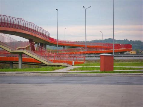 Pedestrian Bridge With Red Railing Over A Highway Stock Image Image