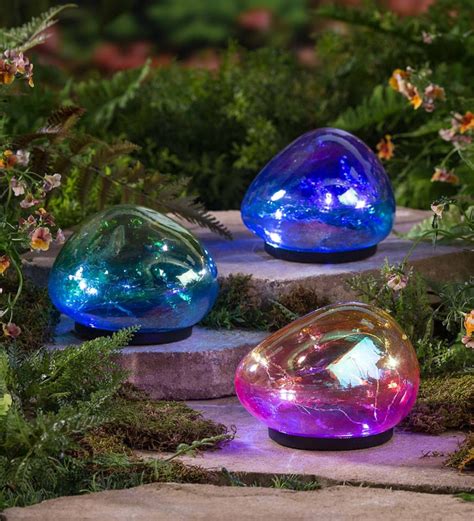 Add A Little Mystery To The Landscape With These Colorful Solar Glass Garden Globes By Day