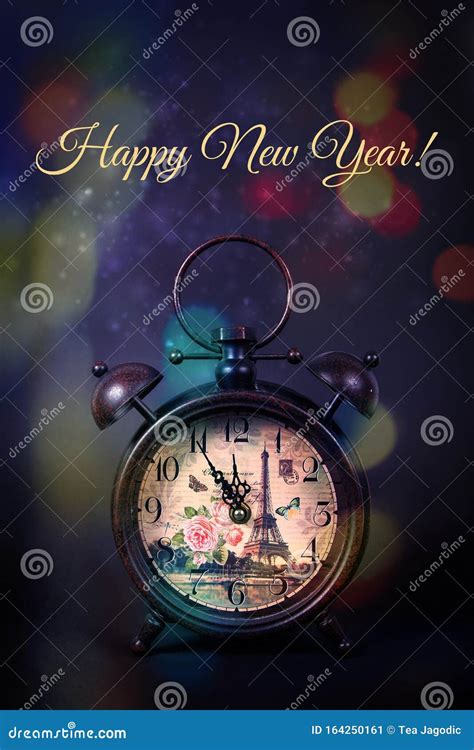 An Old Vintage Clock And Sparkles On A Black Studio Background And