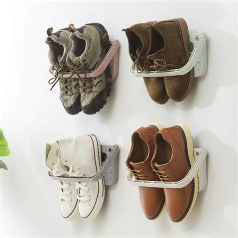 Making a shelf for shoes seems like it couldn't really improve your life, but it's really helpful. Wall-Mounted Sticky Hanging Shoe Holder Hook Shelf Rack ...