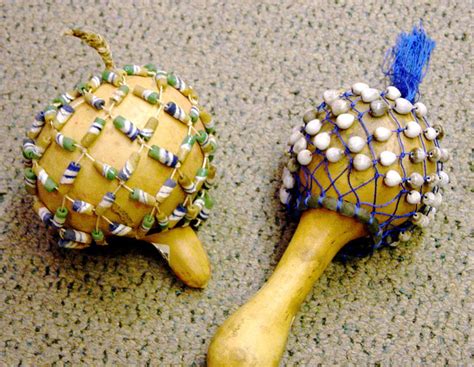 African Rattles Made Out Of Gourds And Decorated With Beads And Shells