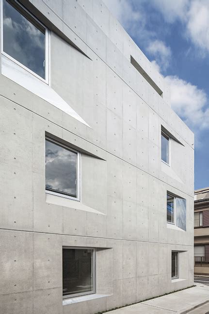 Concrete Apartment Building Emphasizes Square Frame As A Whole