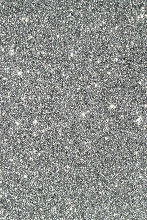 Silver sparkles on white background. Silver glitter background. Silver colored sparkly ...