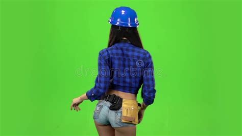 Rear View Of Girl Booty Dancing In A Green Background Slow Motion