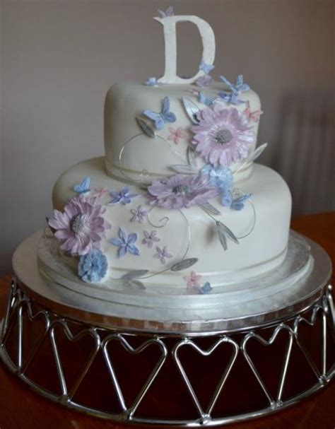 Cakes by samantha is a premier cake maker for the south west and will deliver wedding cakes, birthday cakes, anniversary cakes and corporate cakes anywhere in the west country incuding: 2 tier white round birthday cake with flowers and monogram ...