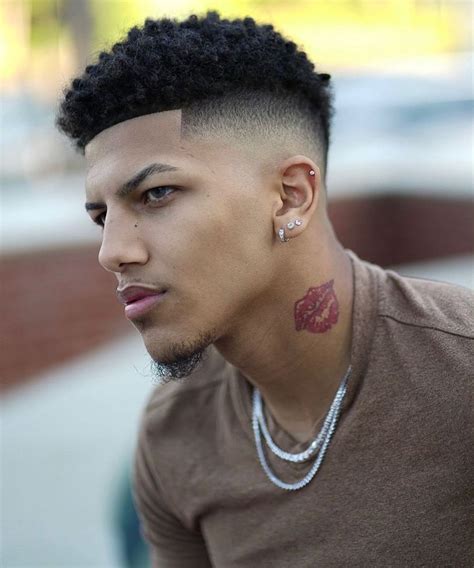 For black men with a slightly straighter hair texture, this brushed up style offers up a clean and simple way to wear your short hair. Pin em Black Men's Haircuts