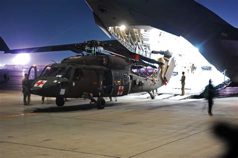 Us Soldiers Off Load An Hh 60m Black Hawk Medical Evacuation