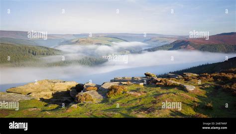 Early Morning Fog Lingering Above The Ladybower Reservoir In The Valley