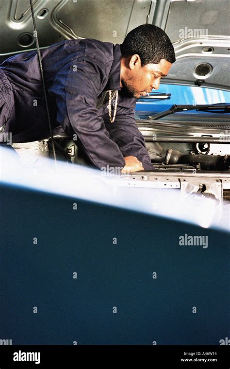 Mechanic Working On Engine Stock Photo Alamy