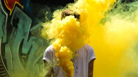 Download Wallpaper 1920x1080 Man Colored Smoke Yellow