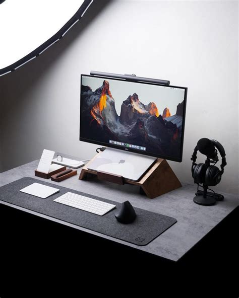 A Computer Monitor Sitting On Top Of A Desk Next To A Mouse And Headphones