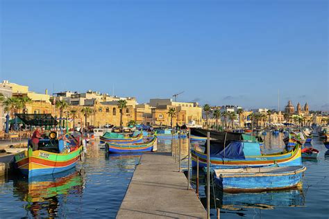 Boats In Marsaxlokk Fishing Village Port In Malta Photograph By Artur