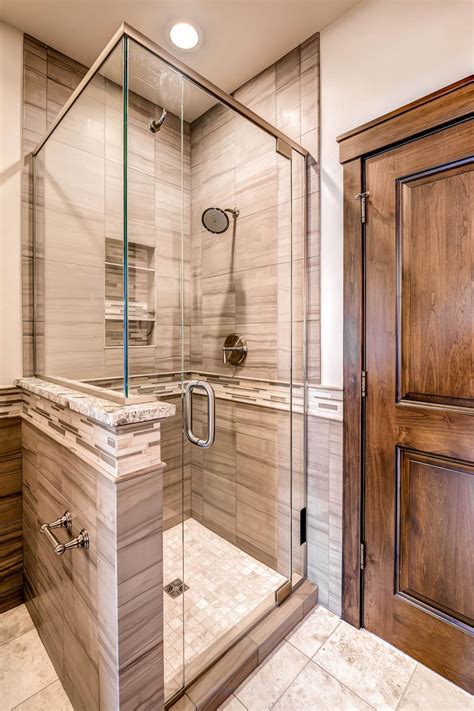 Shower walls can be improved using porcelain or ceramic tiles. Glass Shower With Gray Tile | HGTV