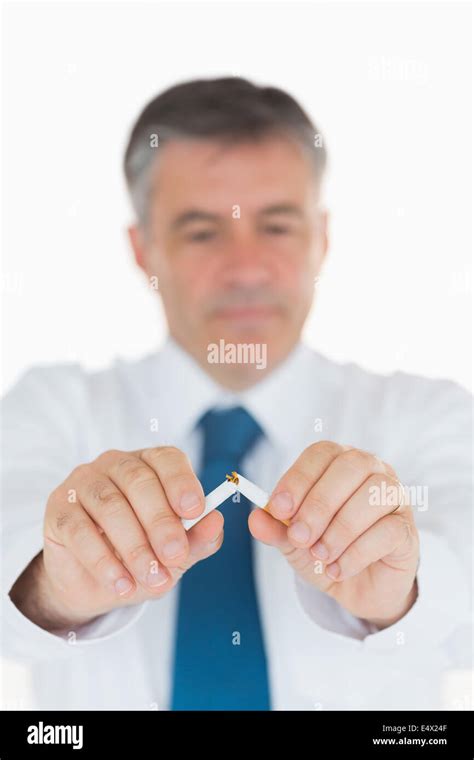 Man Concentrating On Breaking Cigarette Stock Photo Alamy