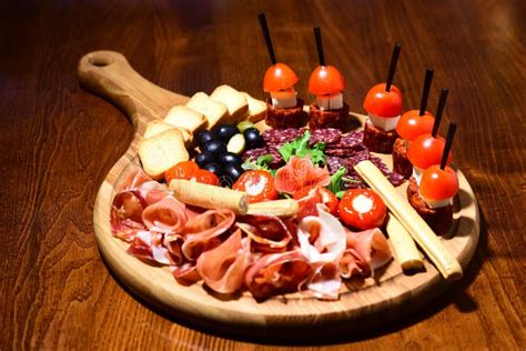 Meat Platter With Canape On Wooden Table Cold Meat Cuts In Restaurant