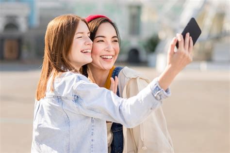 Free Photo Girlfriends Taking Selfie Together