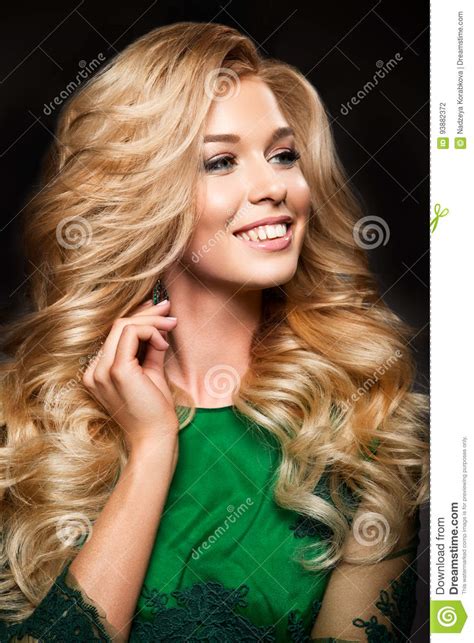 Portrait Of Elegant Blonde Woman With Long Curly Hair And Glamour