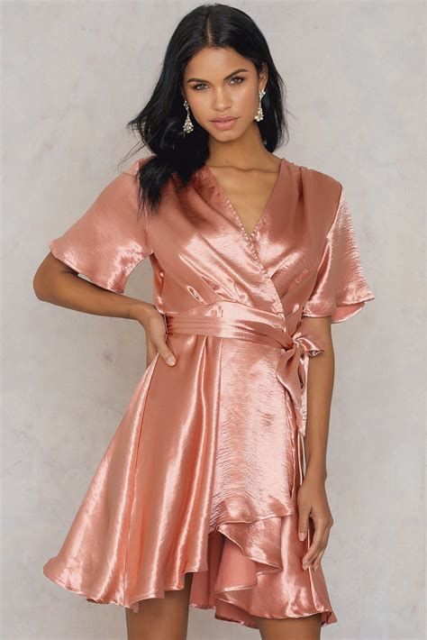 The Metallic Wrap Over Dress By Na Kd Features A Shiny Fabric A Wrap