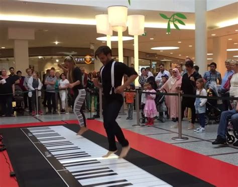 Couples Floor Piano Playing Draws Enthusiastic Crowd