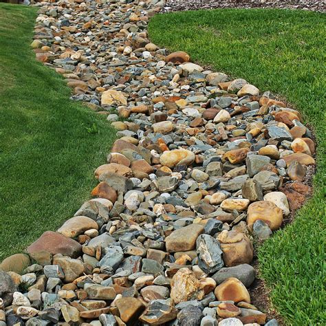 Decorative profile with a pronounced visible surface. Petty's Irrigation & Landscape, Ltd. - Drainage - French Drains