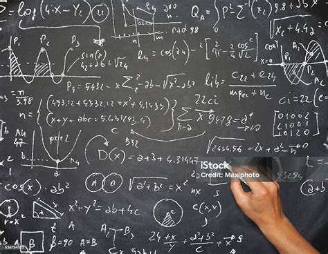 Teacher Hand Writing Complicated Math Formula On Blackboard Stock Photo