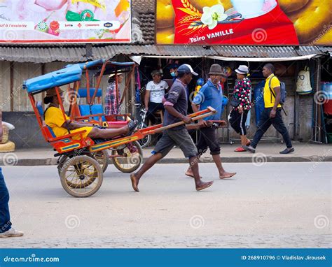 Barefoot Men Pull Rickshaws In Ansirabe Southern Madagascar
