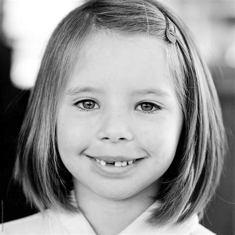 Girl Missing Tooth By Stocksy Contributor Thomas Hawk Stocksy
