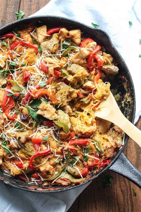 Roasted strands of squash mixed with hot creamy chicken, topped with melting cheese and served in its own shells. Cajun Chicken Spaghetti Squash Bake | Destination Delish