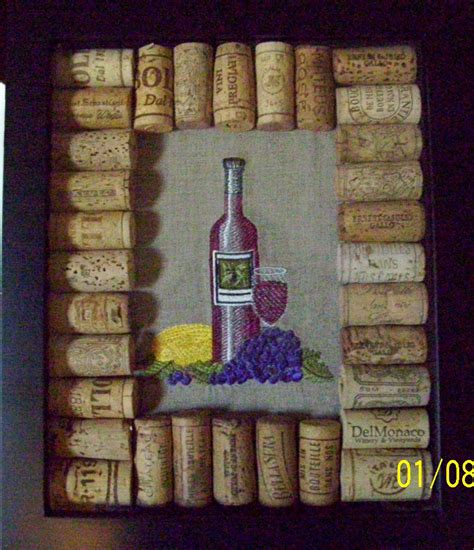 It will look even better once there are more wine corks in there!! Made this for a friend. It is a shadow box picture frame ...
