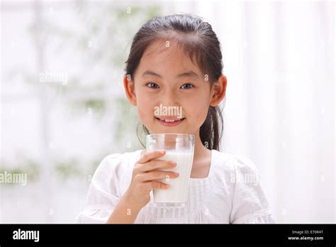 Girl Drinking Milk Stock Photo Alamy