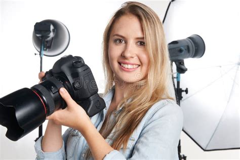 Female Professional Photographer Working In Studio Stock Photo Image