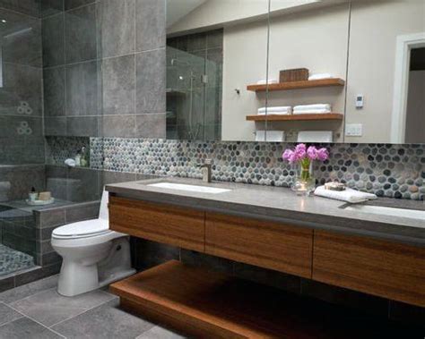The tiles' rounded edges and range of blue hues beautifully contrast crisp, white cabinets that are characteristic of coastal kitchens. Top 70 Best Bathroom Backsplash Ideas - Sink Wall Designs