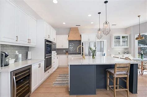 To brighten the space, try a textured white tile backsplash with a glossy finish. White Kitchen with Gray Island (Design Ideas) - Designing Idea