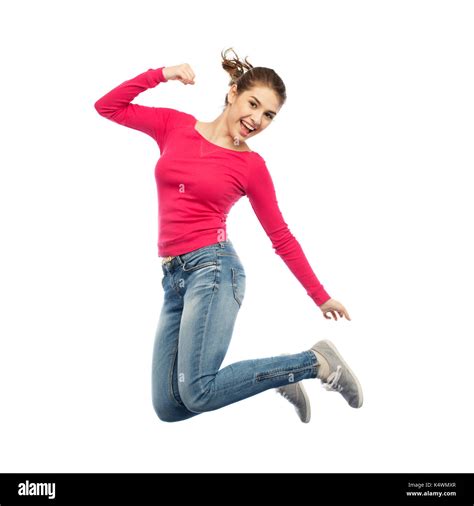 Smiling Young Woman Jumping In Air Stock Photo Alamy