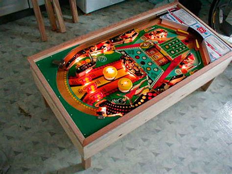 This is a coffee table built from the playfield of a pinball machine. Pinball Machine Mod Pictures - Pinball Mods