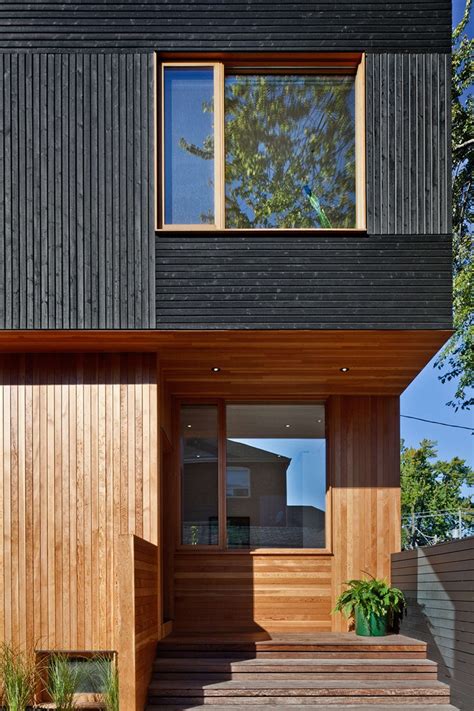 Black Siding With Natural Wood Accents For This Toronto