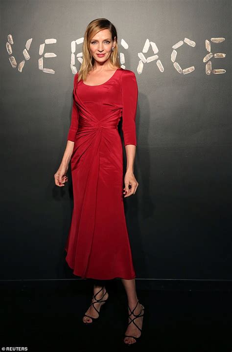 uma thurman stuns in stylish red dress that shows off her model figure at versace presentation