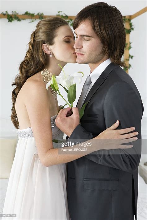Bride Kissing Groom High Res Stock Photo Getty Images