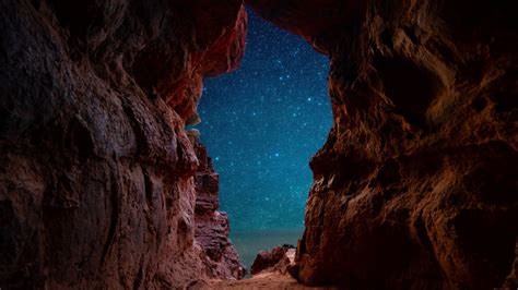View Of Starry Night Through Beach Cave 4k Ultra Hd Wallpaper Background Image 3840x2160