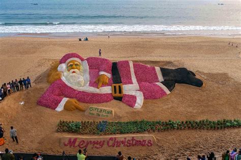 Sand Art Santa Claus Sculpture Created With Sand And Onions On Odisha