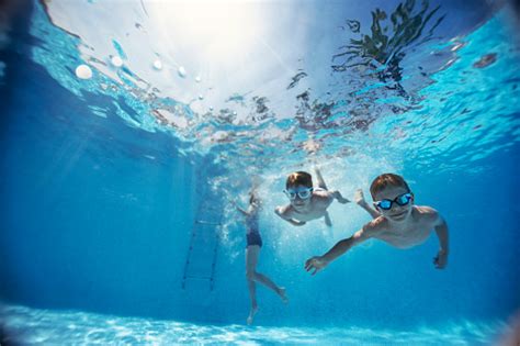 Kids Swimming Underwater In Pool Stock Photo Download Image Now Istock