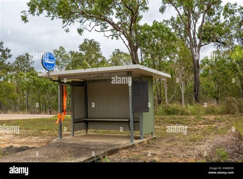 A School Bus Stop Shelter Amongst Bushland In The Country Stock Photo