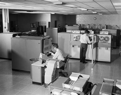 1960s Two Men Technicians Working In Ibm 360 Mainframe Computer Room