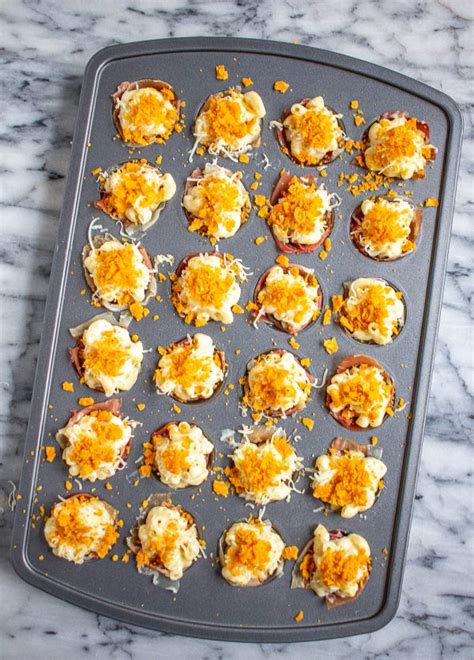 Macaroni and cheese bites are a genius way to use leftover macaroni and cheese. Mac and Cheese Bites | An Easy Super Bowl Snack - thekittchen
